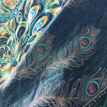 Embroidered upcycled peacock feather denim jacket by Sewincarnation on Etsy