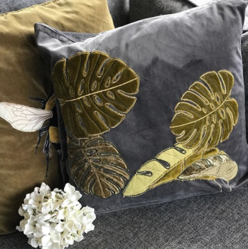 Embroidered and appliquéd tropical leaves cushion