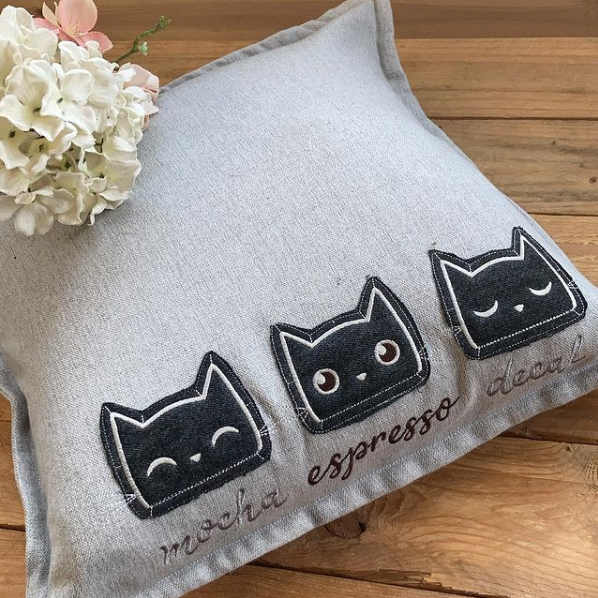Embroidered cat cushion 