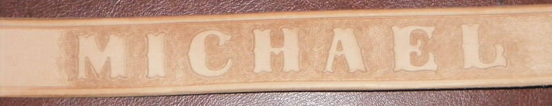 STAMPED AND TOOLED NAME BELT