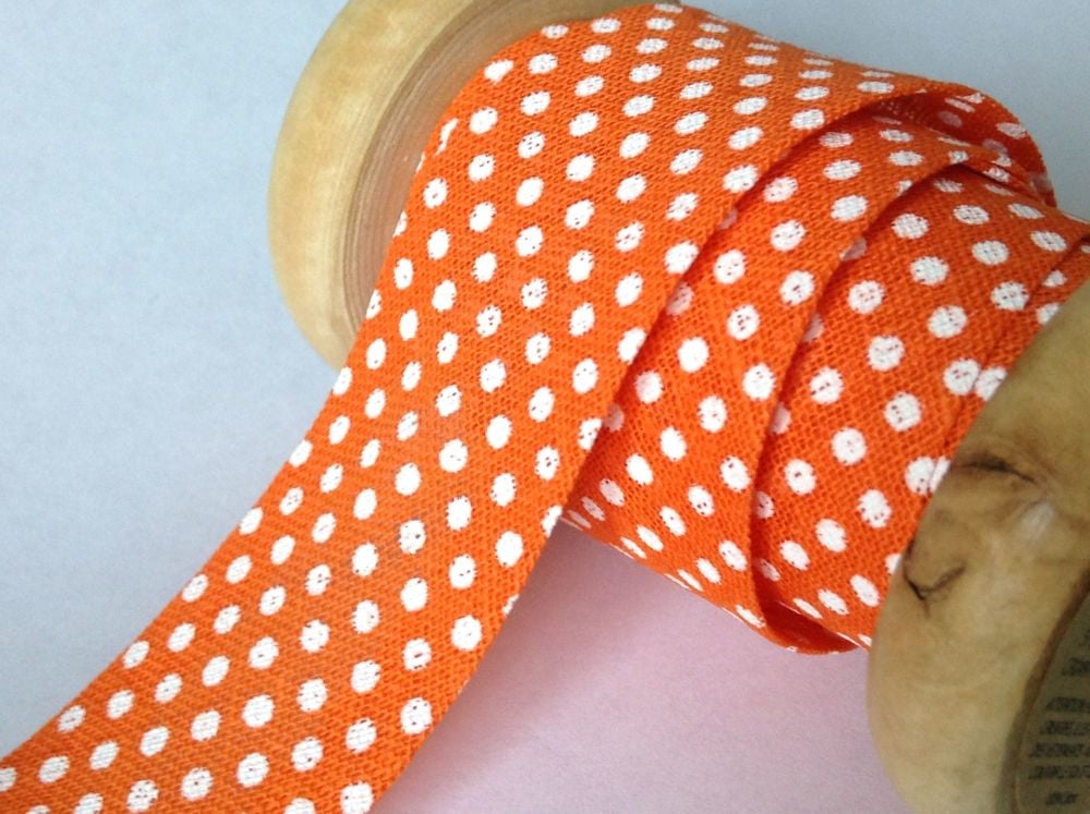orange polka dots pattern bias 25mm white spots on tangerine fabric 1m