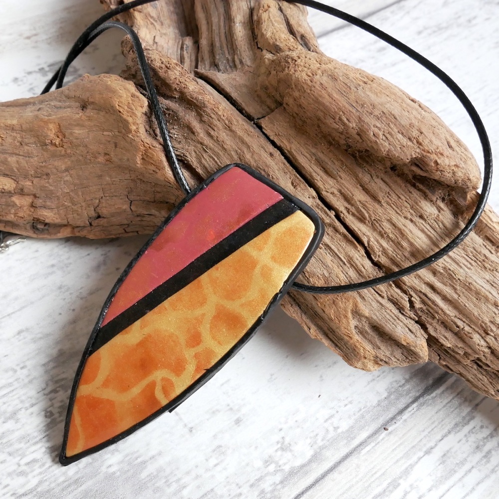 Gold Patterned Pendant Necklace with Rust Accent