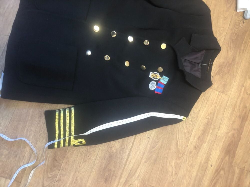 childs titanic coat 20-22 inch sleeve length, fabric badges