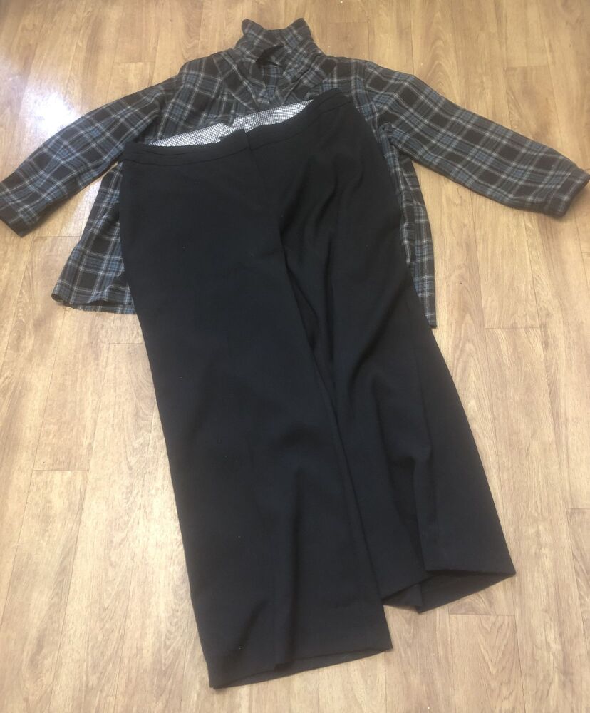 checked woollen shirt and black woollen mix trousers