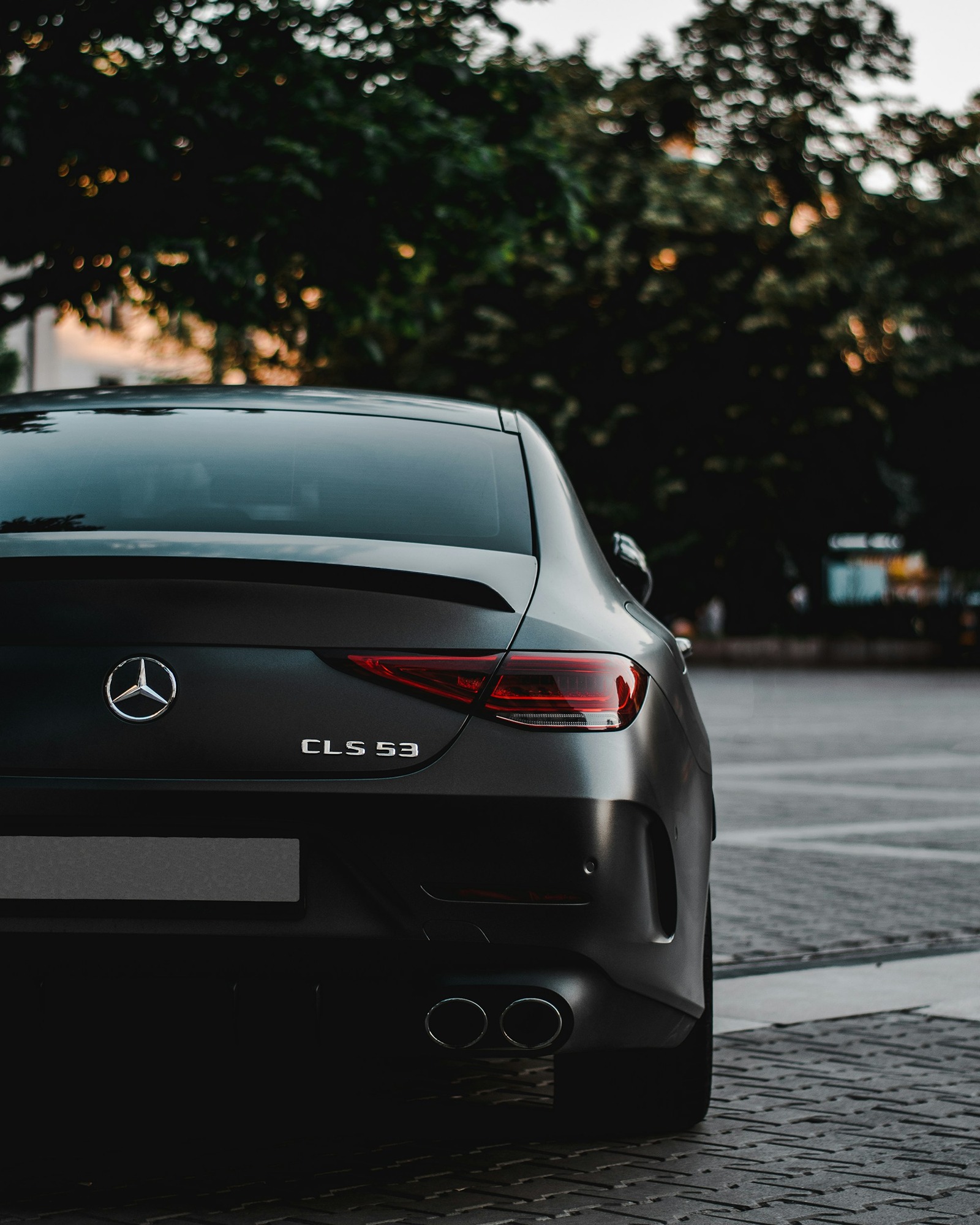 black-bmw-m-3-on-road-during-daytime-DkMliTo7NqA