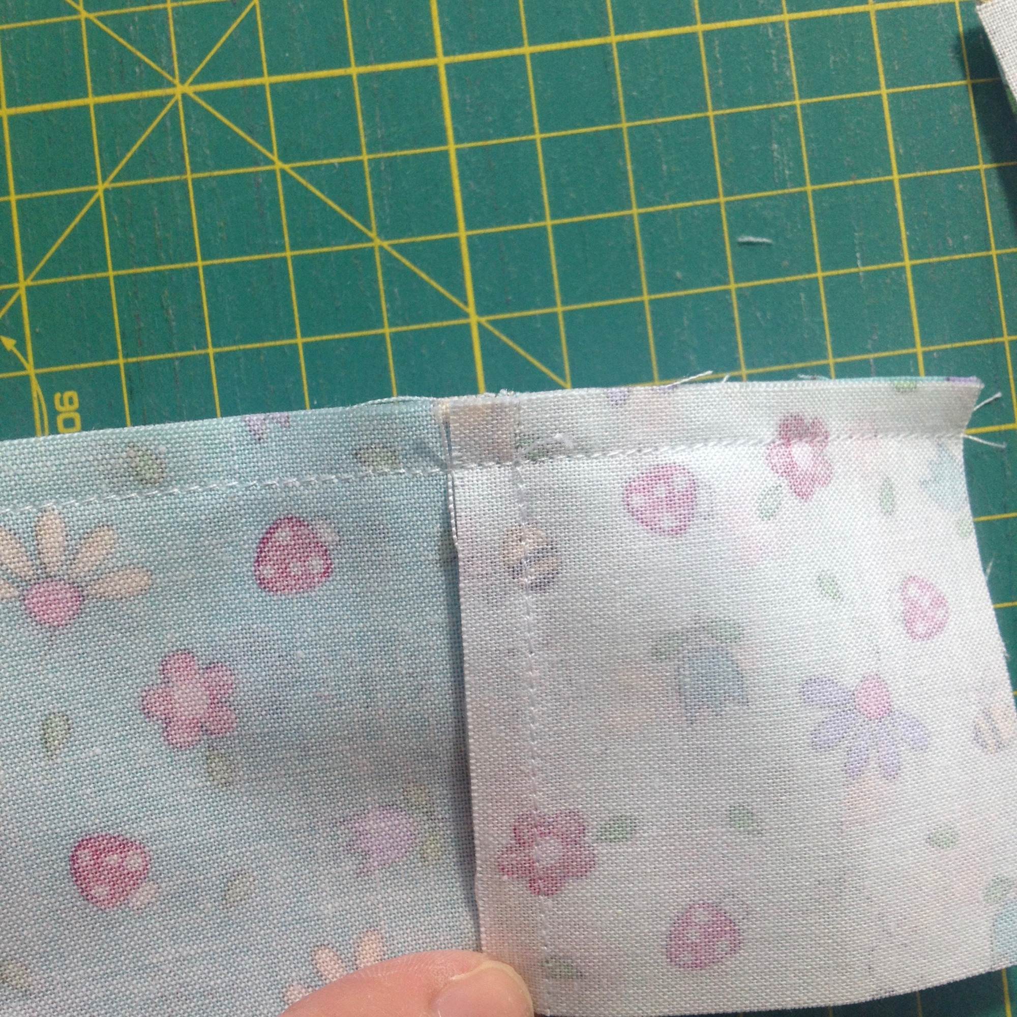 Flattening a seam in a four-patch