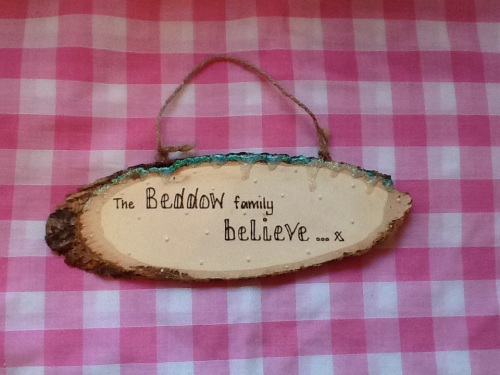 this house believes personalised wooden sign plaque