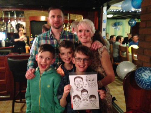 My lovely family and our caricature