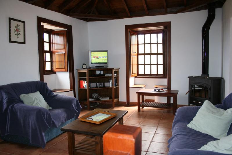 Casa Las Embelgas lounge with log stove
