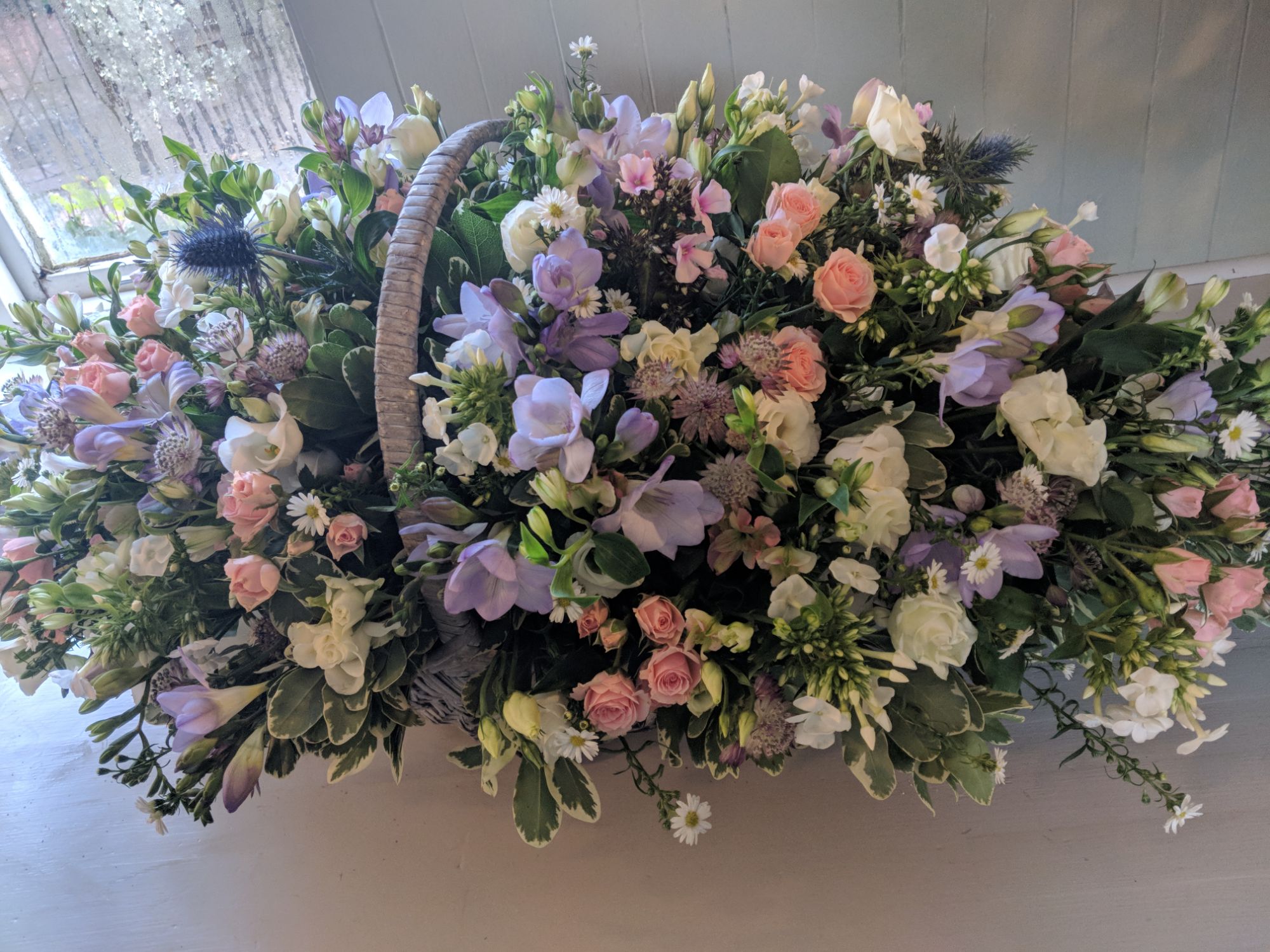 basket of flowers funeral arrangement Crawley