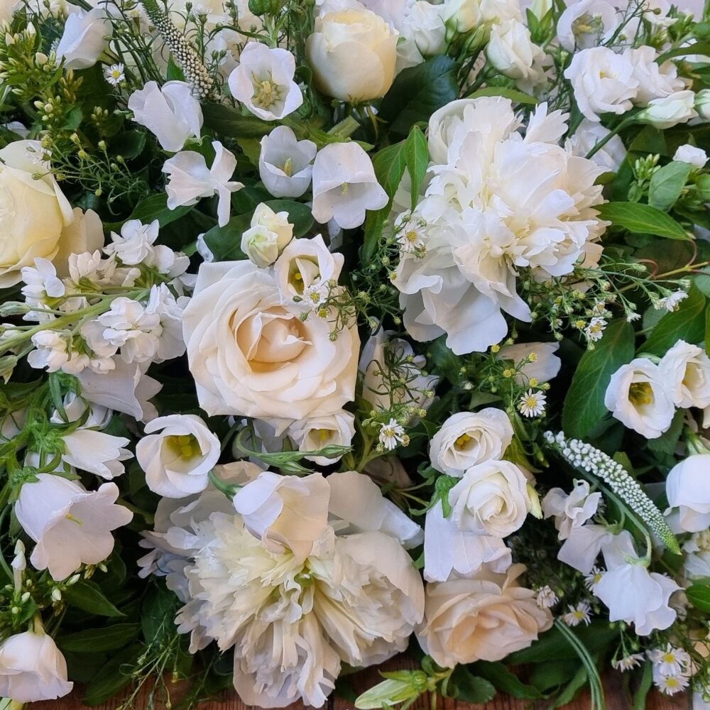 10. All White Seasonal Coffin Spray. Price From