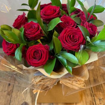 1. Red Naomi roses & foliage bouquet in water. Price from