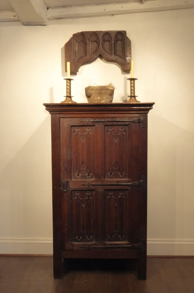 An English Tudor Carved Oak Linenfold Cupboard SOLD