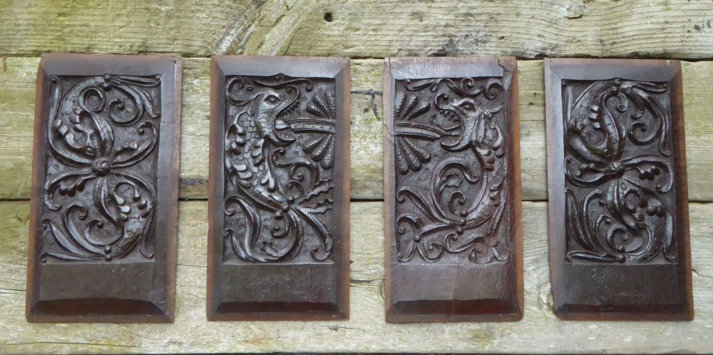 A Set Of Four Henry VIII Period Carved Oak Panels Of Fish Wyverns SOLD