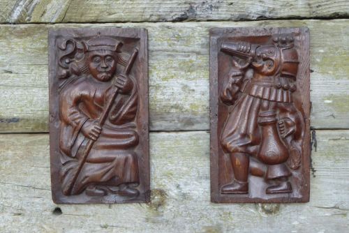 A Rare Pair Of 16th Century Carved Oak Panels Depicting Two Merry Gentlemen