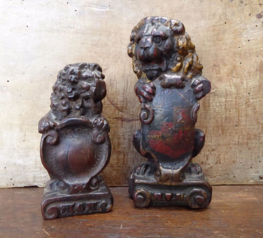 Two Early 17th Century Polychrome Carved Oak Seated Lions With Painted armorial Sold