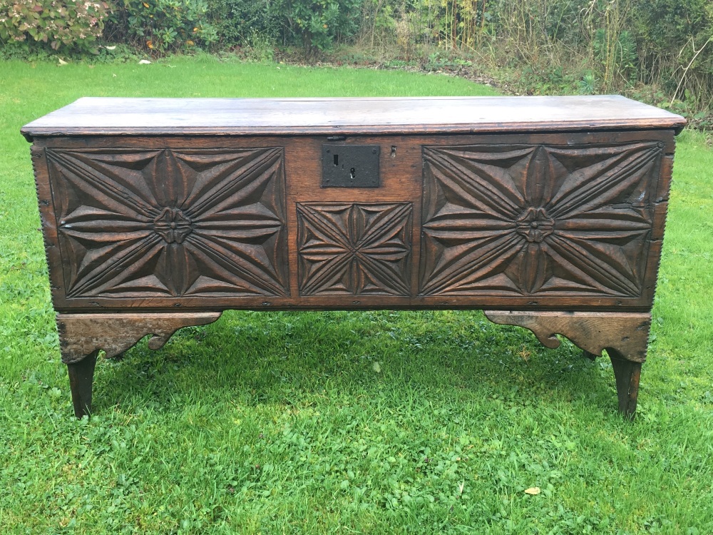 A fantastic mid 16th century English carved oak board chest SOLD