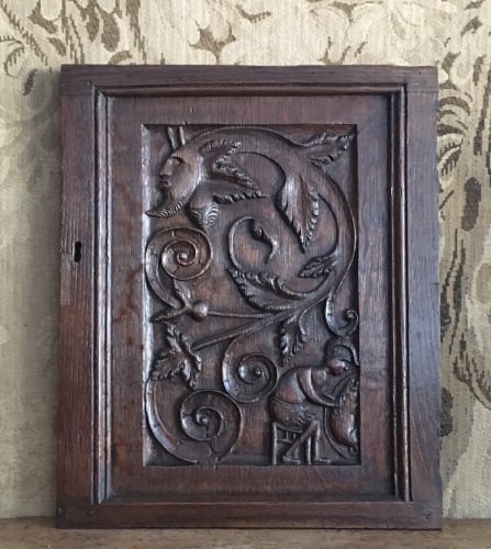 A Folky 17th Century Carved Oak Panel Depicting The Greenman And A Man Seat
