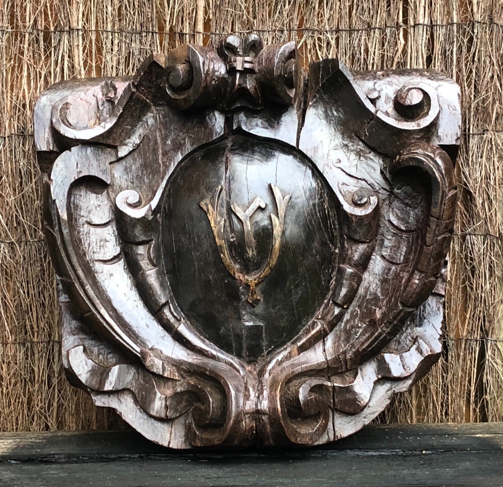 An Early 17th Century Carved Oak Armorial Cartouche.