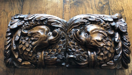 A Pair Of 16th Century Carved Walnut Wyvern Head Panels.