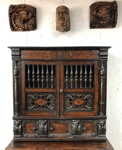 An Important Late Elizabethan Carved And Inlaid Oak Mural /Glass Cupboard