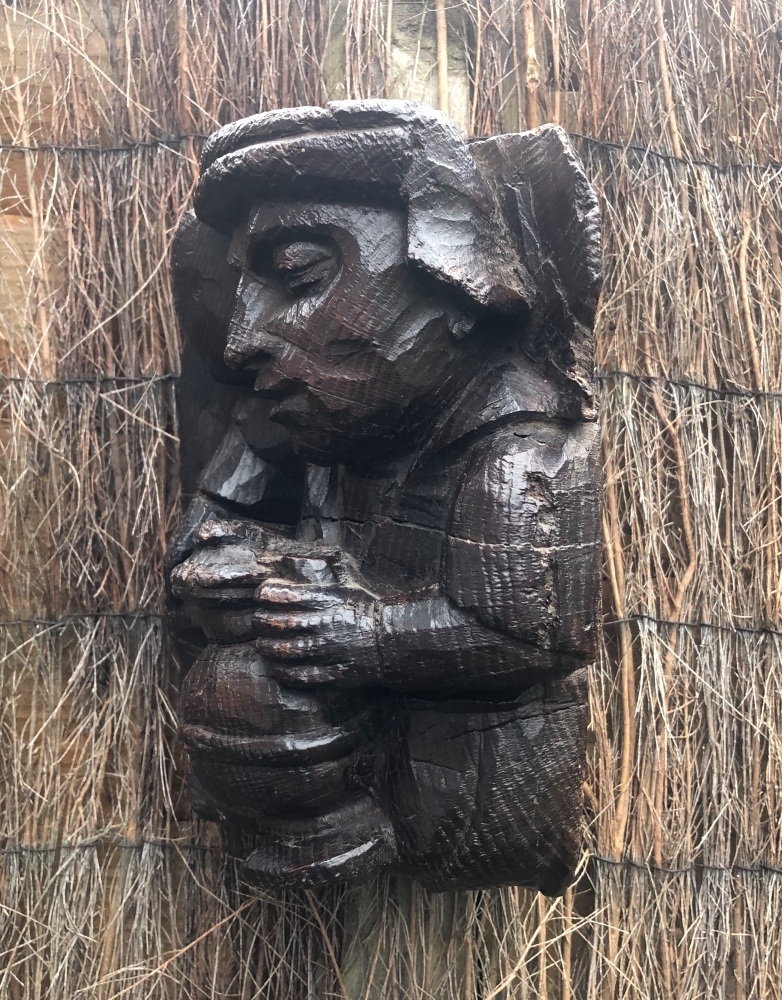 A Rare Late 15th Century Corbel Depicting A Labourer Drinking From A Bellie