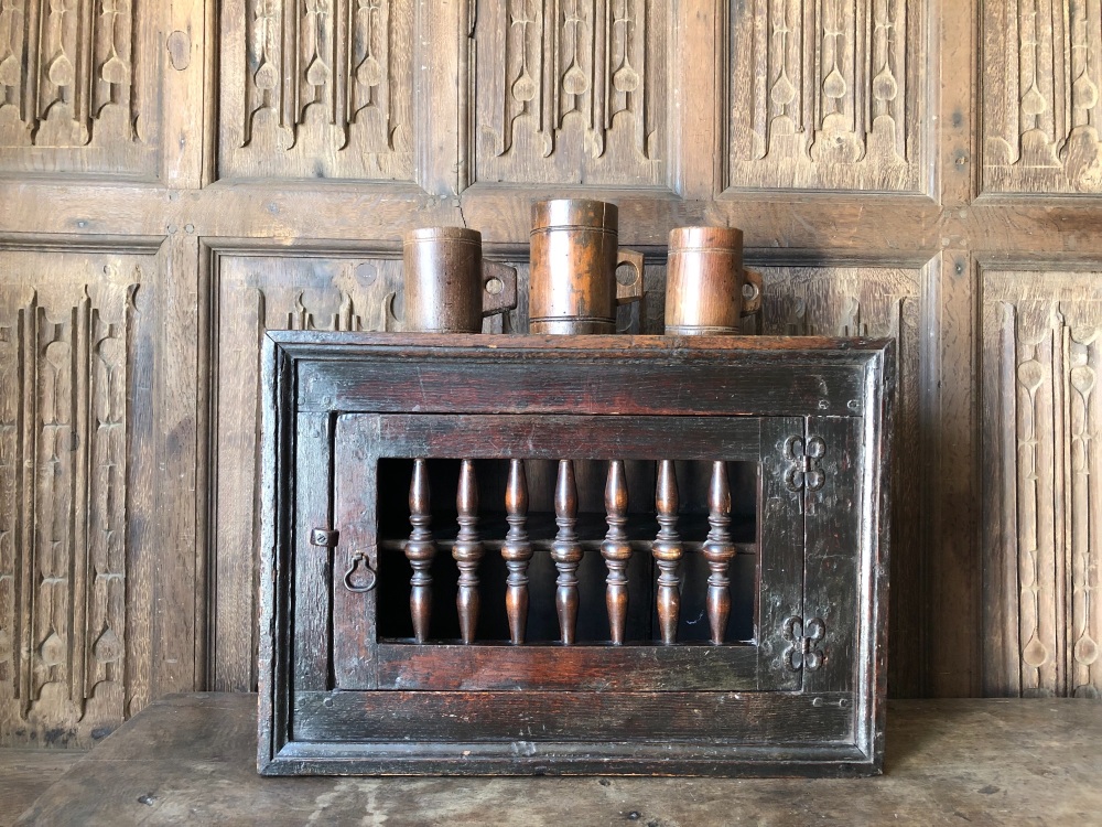 A Wonderful 17th Century  Oak Mural Cupboard with Spindled Door Of Small Proportions....SOLD