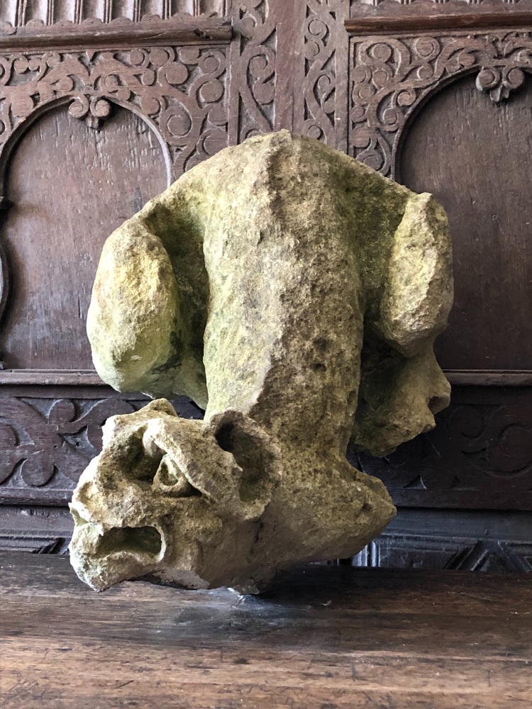 A 15th Century Medieval Carved Stone Howling Dog.