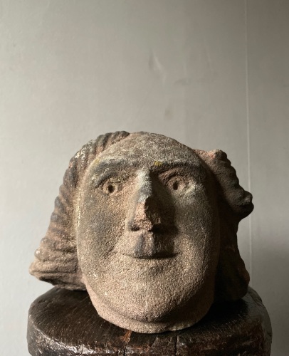 A 16th Century Carved Stone Head Of A Man .