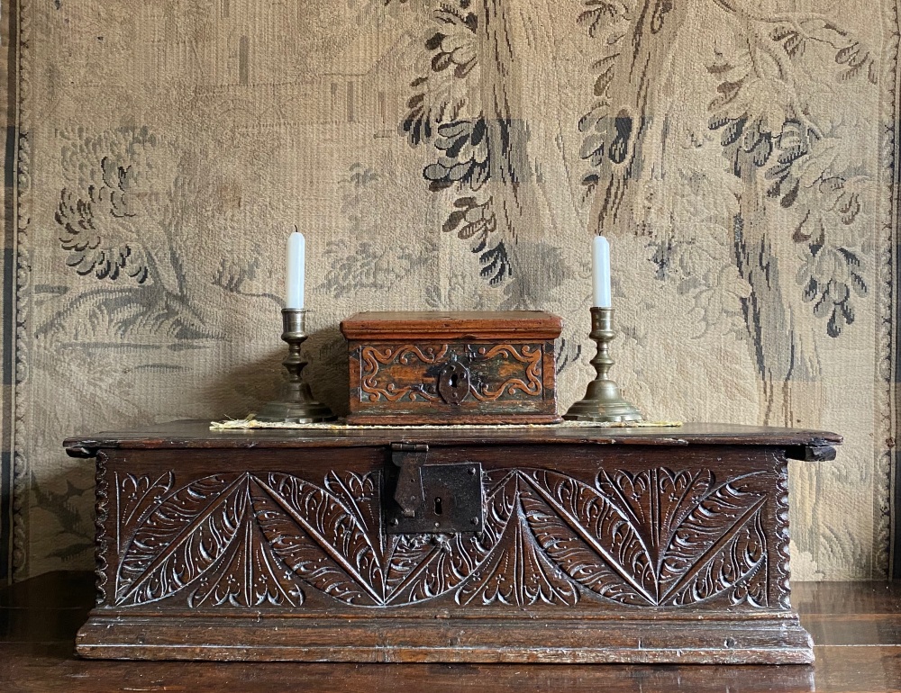 A Delightful 17th Century Carved Pine And Painted Slope Of Diminutive Size. SOLD