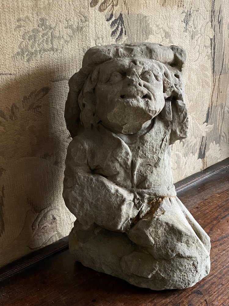 A Medieval Carved Stone Grotesque Lammas Figure .
