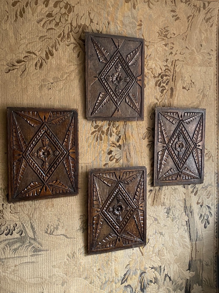 A Set Of Four 16th Century Carved Oak Panels From A Tudor Cupboard Door