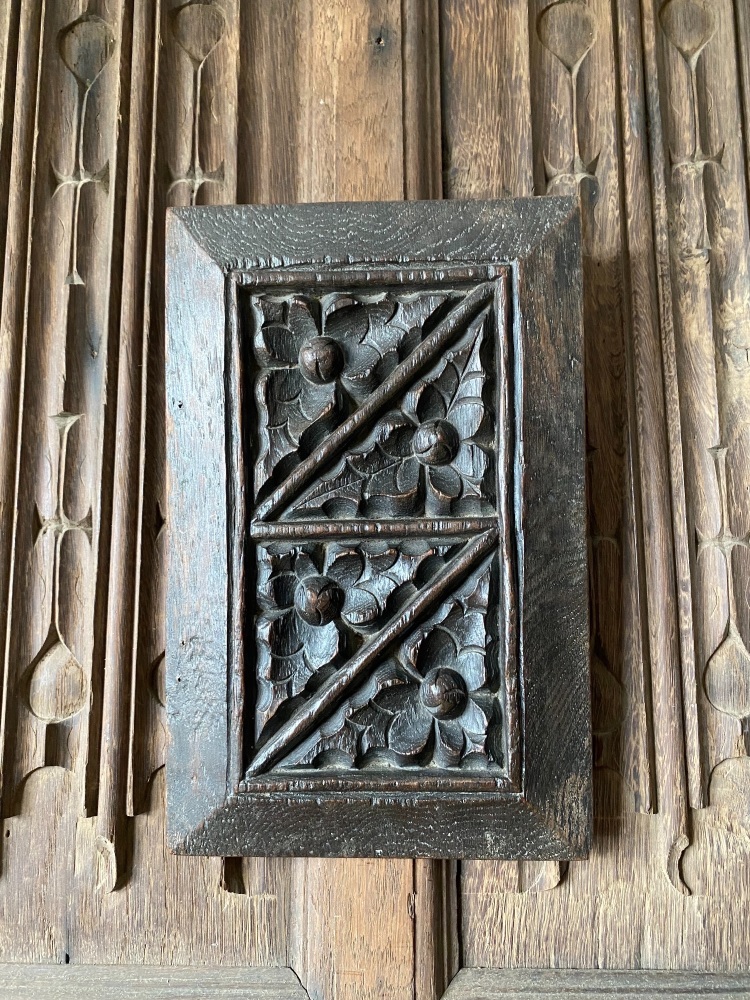 An English 16th Century Carved Oak Panel Depicting A Leaf And Bud Design.