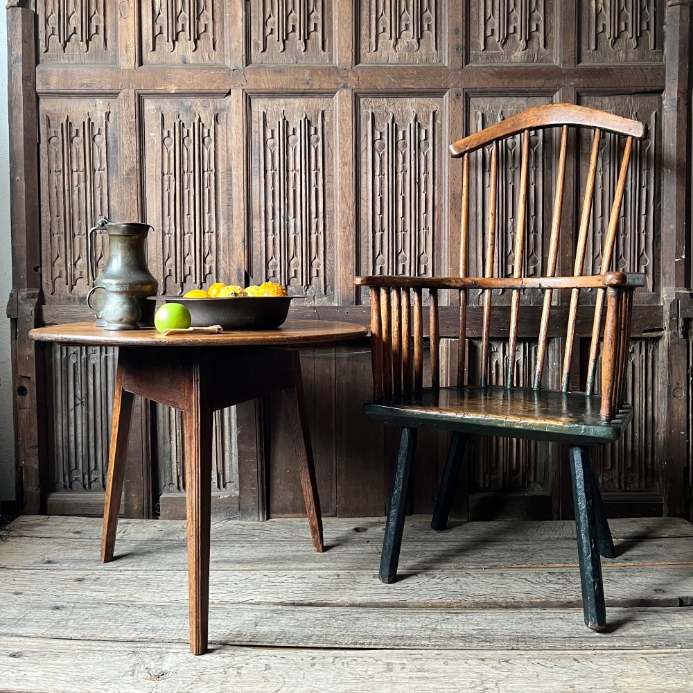 A Late 18th Century Primitive Comb Backed Windsor Armchair  .