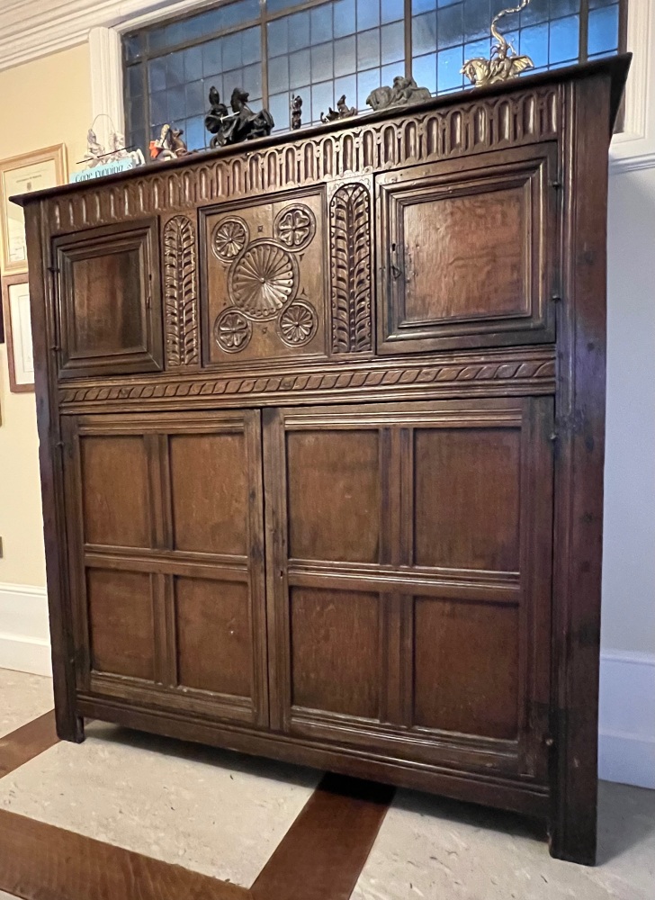 A 17th Century Carved Oak Hall / Livery Cupboard .