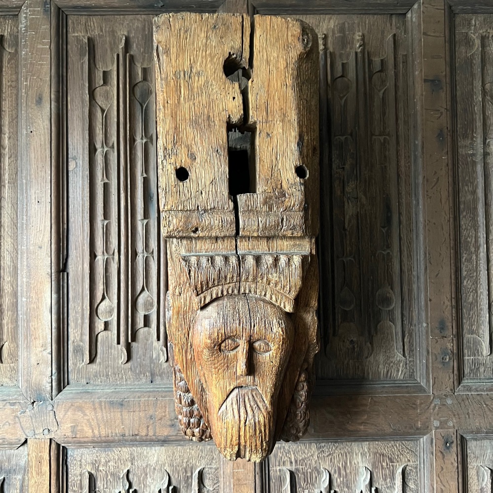 A 16th Century Carved Oak Corbel Post Depicting The Head Of King Louis VII and Flanked with a Fleur-De-Lis.SOLD