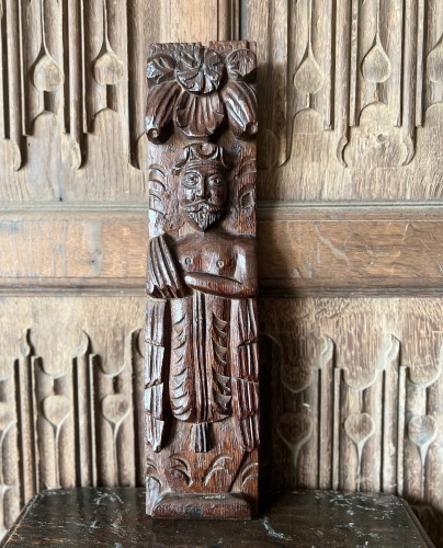 An Elizabethan Carved Oak Term Figure Of A Bearded Gentleman.