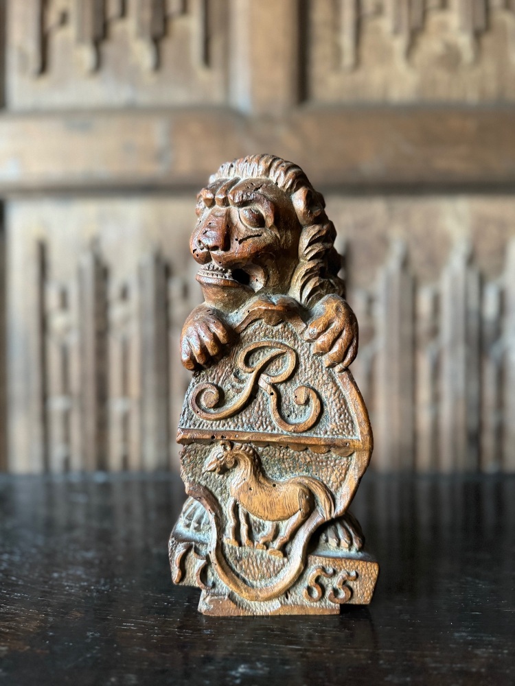 An 18th Century Carved Walnut Figure Of A Rampant Lion Supporting A Heraldi