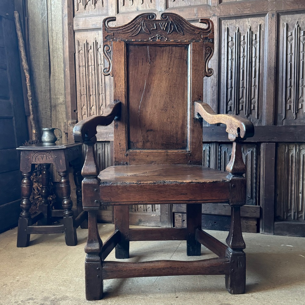 A 17th Century Oak Wainscot Chair Initialled J.W.B with Unusual Turned Front Legs. SOLD