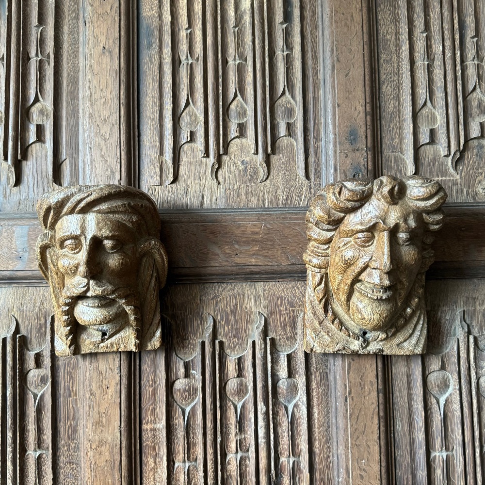 A Pair of 17th Century Carved Oak Corbels Depicting Grotesque Faces.