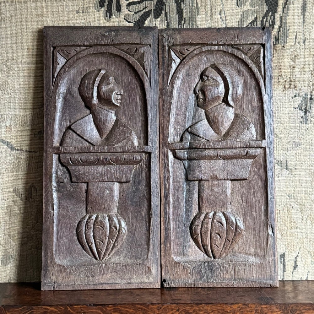 A Simple Pair Of 16th Century Carved Oak Portrait Panels.