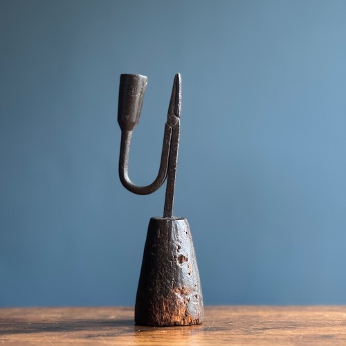 A 19th Century Iron Rushlight On Its Original Conical Stained Base.