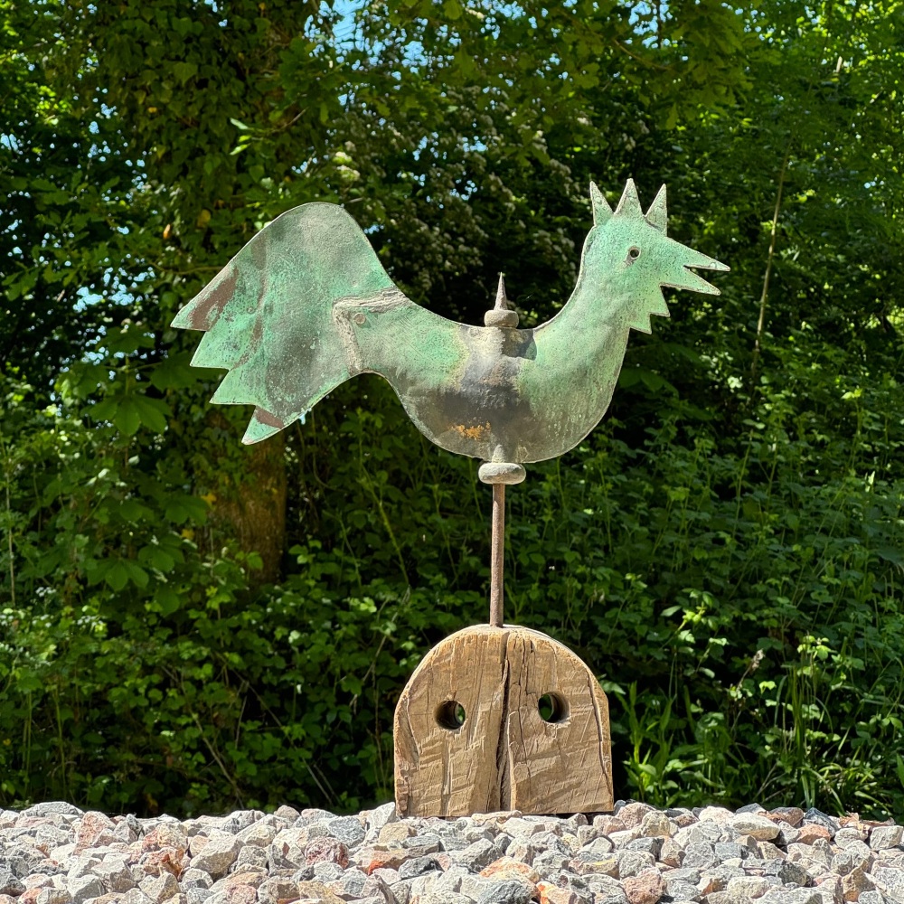 A 19th Century Copper Weather Vane In The Form Of A Cockerel Standing On A Weathered Base.