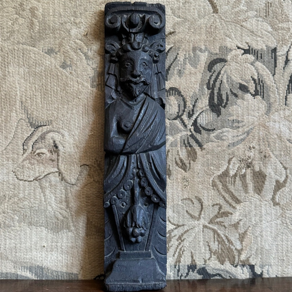 An Elizabethan Carved Oak Term Figure Of  A Bearded Gentleman.