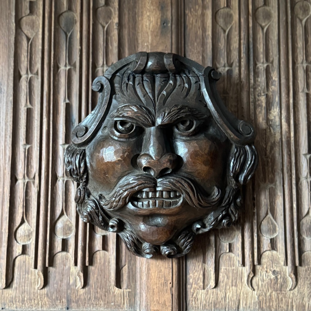 A Baroque Carved Walnut Grotesque With Stern Expression.