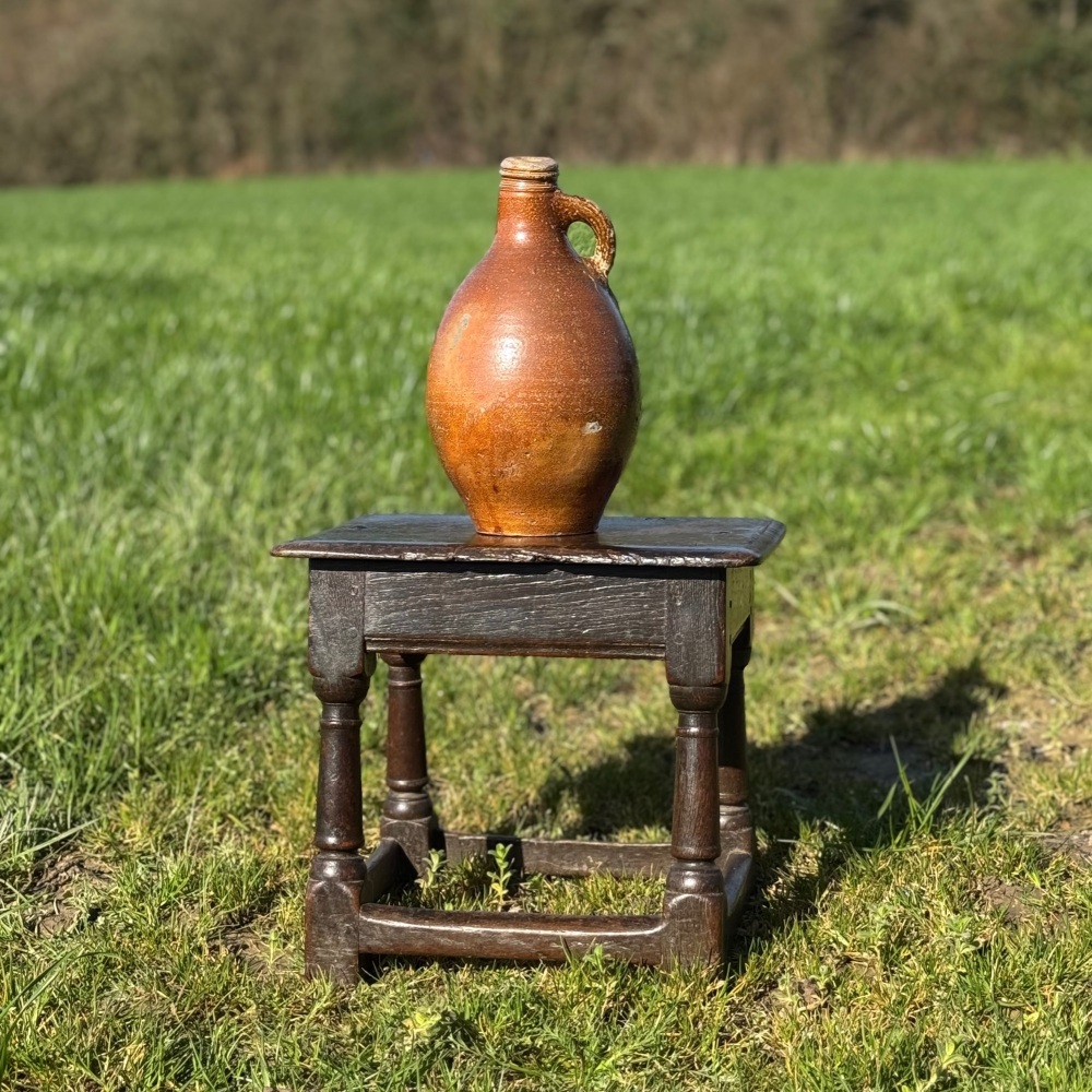 A 17th Century Joined Oak Low Stool.