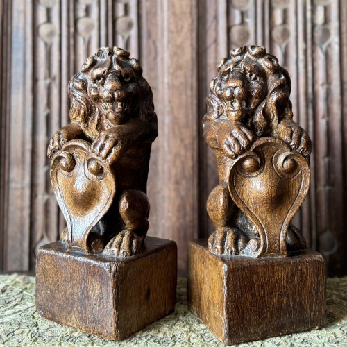 A Pair of Early 17th Century Carved Oak Lion Newel Posts.