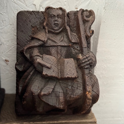 A 16th Century Carved Oak Beam End Depicting An Abbess.