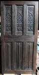 A 16th century English carved oak Gothic Door With Tracery Panels