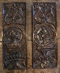 A pair of 16th century English carved oak romayne profile panels